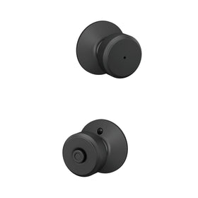 Schlage F40 Bowery matte black knob close-up highlighting privacy lock