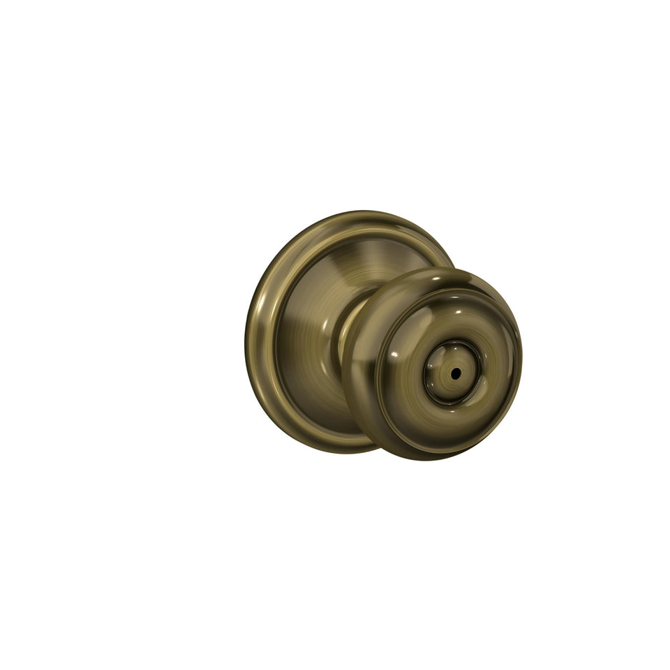 Schlage F40 GEO 609 Georgian door knob front view in antique brass, classic style