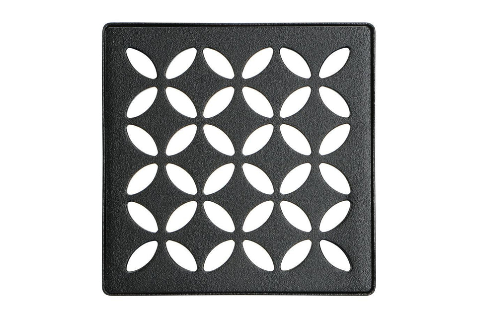 Schluter Kerdi-Drain floral shower grate with integrated bonding flange for secure waterproofing in tile showers.