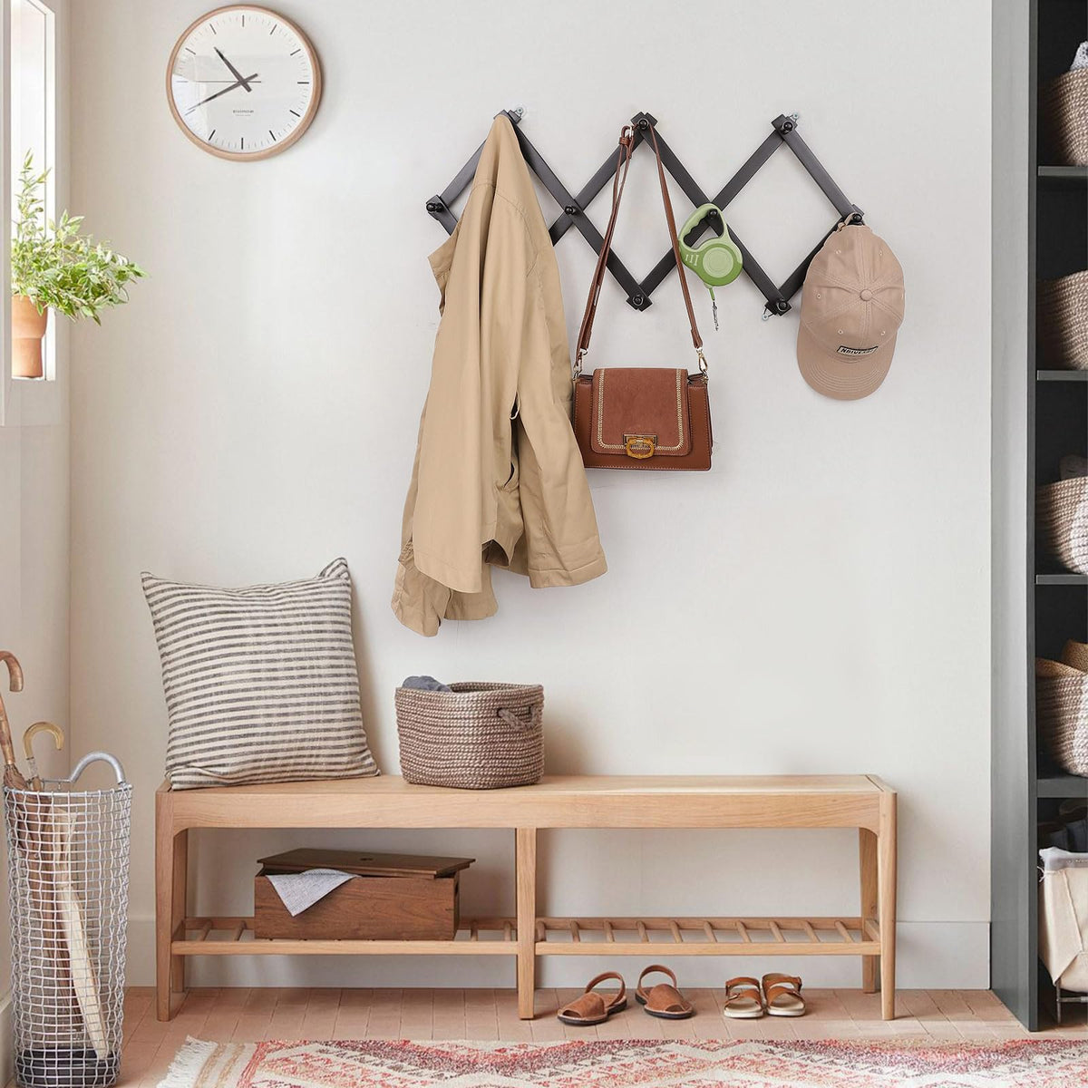 SCUNDA Wall Rack black finish complements many spaces.