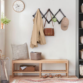 SCUNDA Wall Rack black finish complements many spaces.