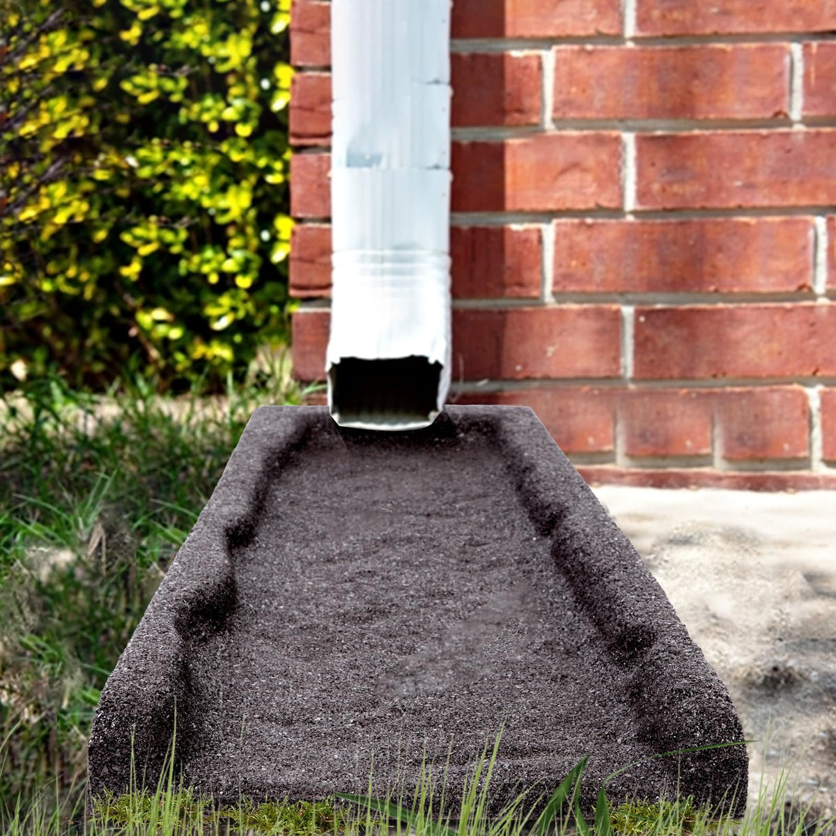 Sekcen splash block features a sloped design to spread water away from foundations.