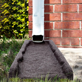 Sekcen splash block features a sloped design to spread water away from foundations.