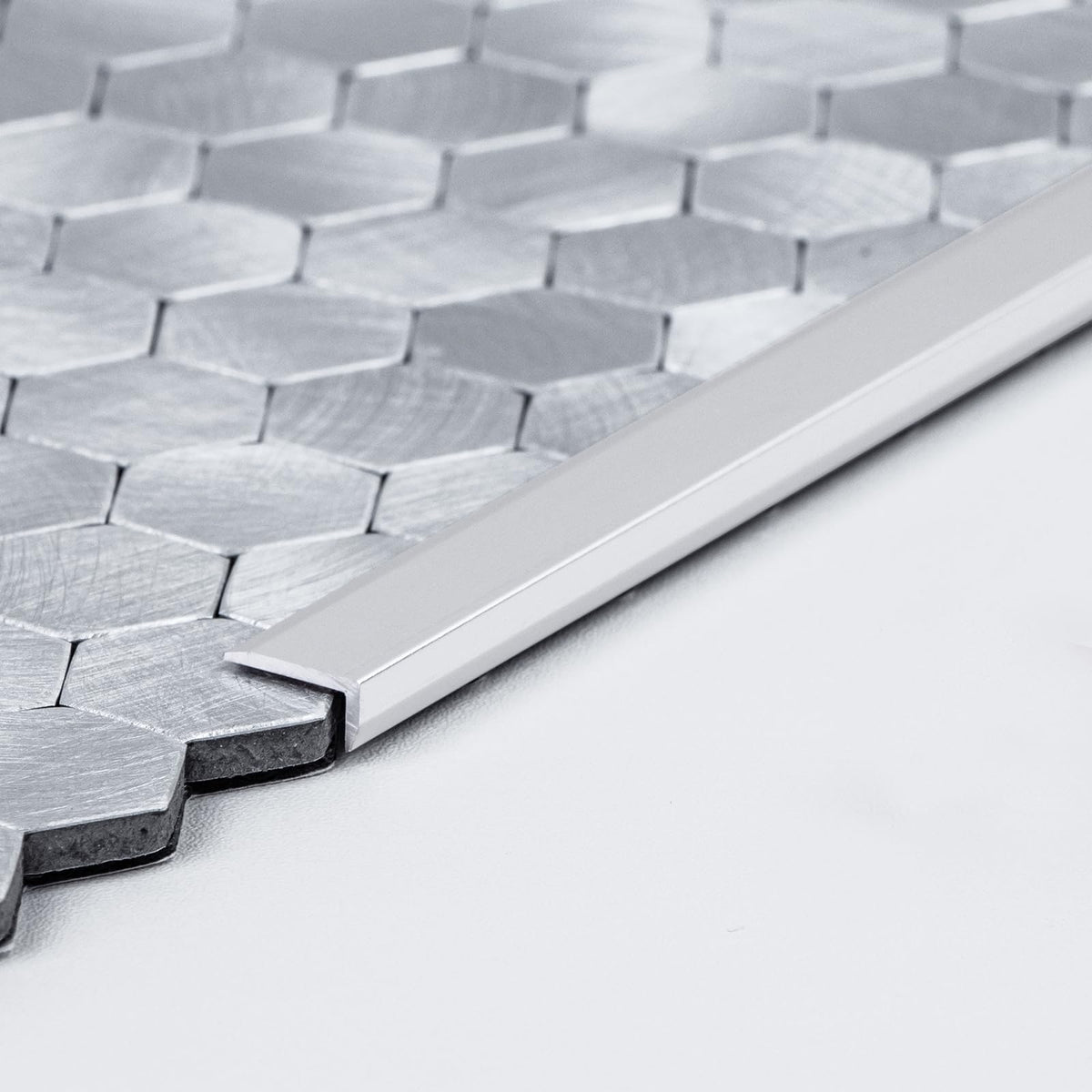 SELECT LIGHTING brushed nickel edge trim for hexagon tiles enhances edge durability.