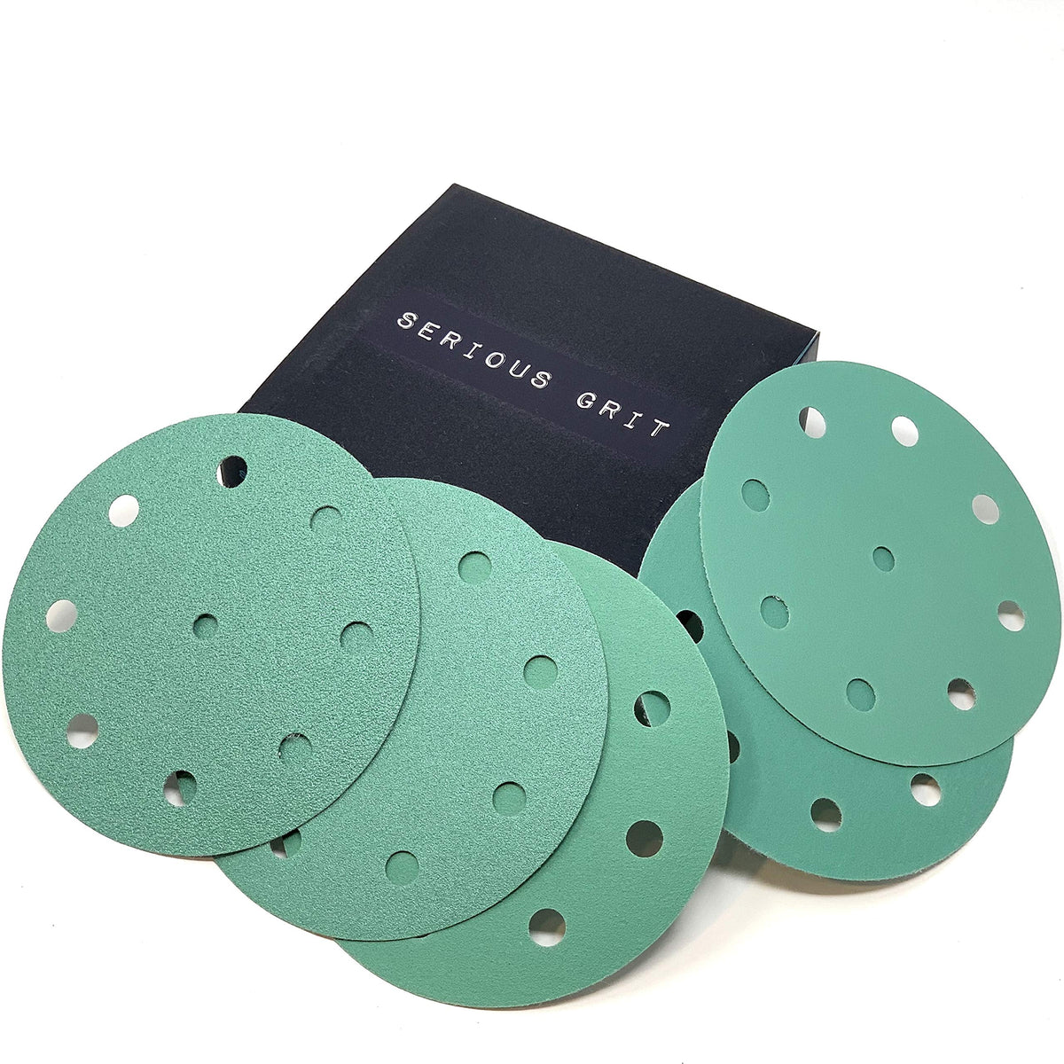Serious Grit 5-Inch disc close-up showing durable film and anti-clog coating for cleaner sanding.