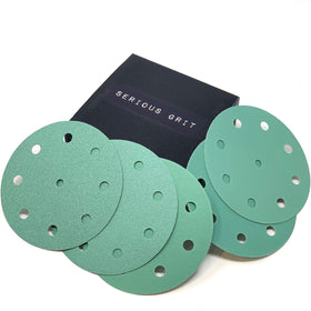 Serious Grit 5-Inch disc close-up showing durable film and anti-clog coating for cleaner sanding.