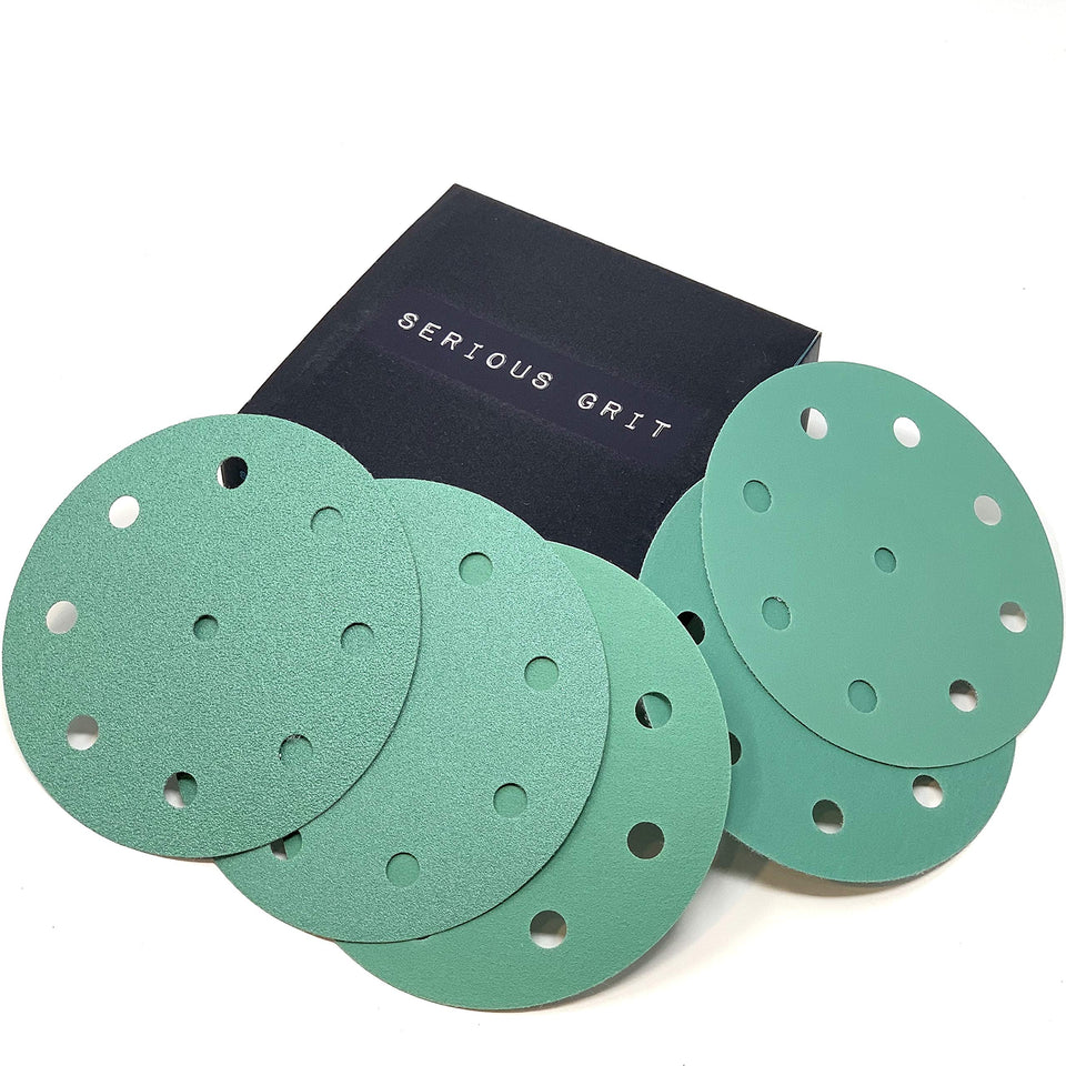 Serious Grit 5-Inch disc close-up showing durable film and anti-clog coating for cleaner sanding.