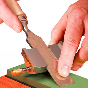 Sharp Pebble honing guide holds blade securely for accurate edges