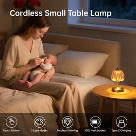 Shenmoyl Tulip lamp at bedside offering soft, cozy nighttime reading light.