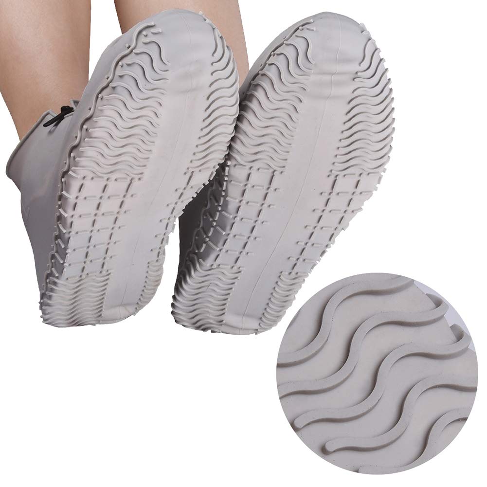 Shiwely grey waterproof shoe cover used outdoors during rain.
