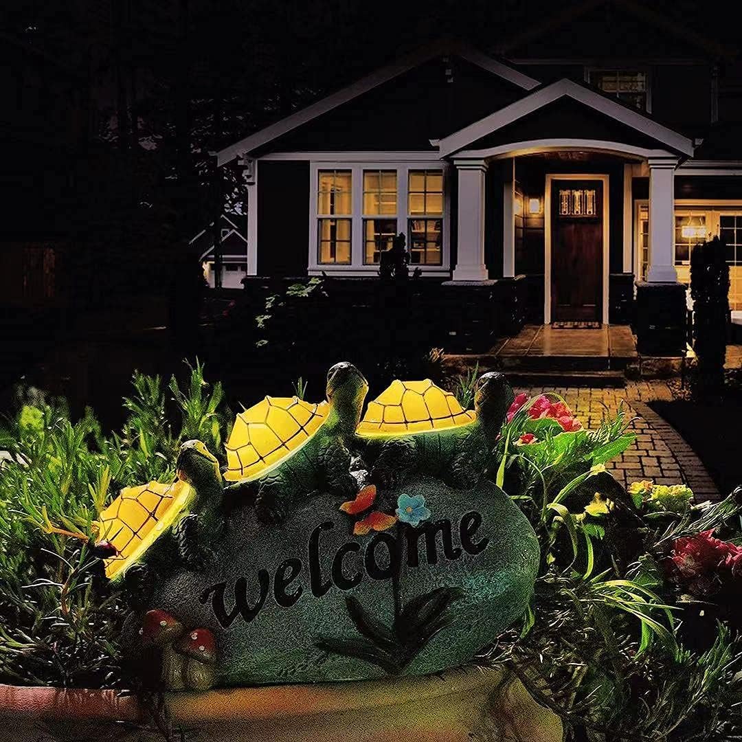 Shumi patio turtle figurine lights softly, guiding guests to entrances after sunset.