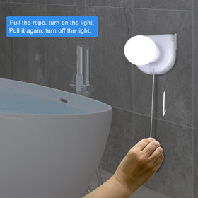 Shuwea stick-on wall light with pull chain provides easy on/off control.