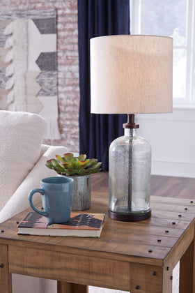 Bandile table lamp on a table provides warm ambient glow for bedrooms.