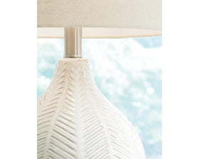 Rainermen white drum shade diffuses light for a cozy bedroom glow.