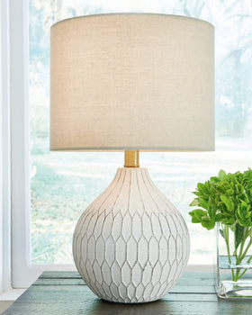 Signature Wardmont table lamp shade highlights a soft, diffused glow for cozy spaces.