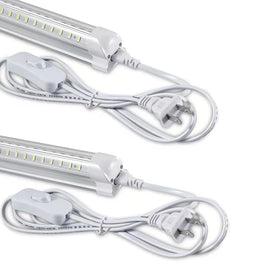 Skymoatled 4ft LED shop light on, bright workshop illumination.