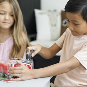 Slice Mini Box Cutter magnet on fridge keeps it handy for quick access.