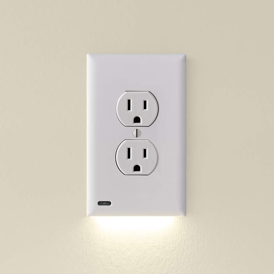 SnapPower GuideLight on a white duplex outlet with subtle, energy-efficient illumination.