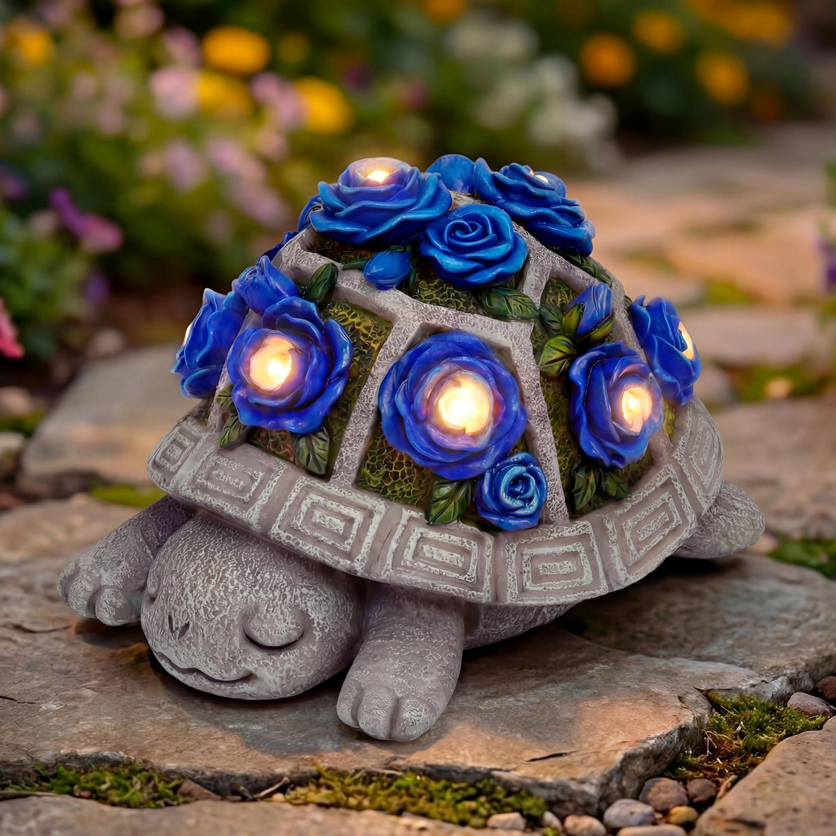 Snclriao solar turtle statue with dark blue roses for sunlit garden decor.