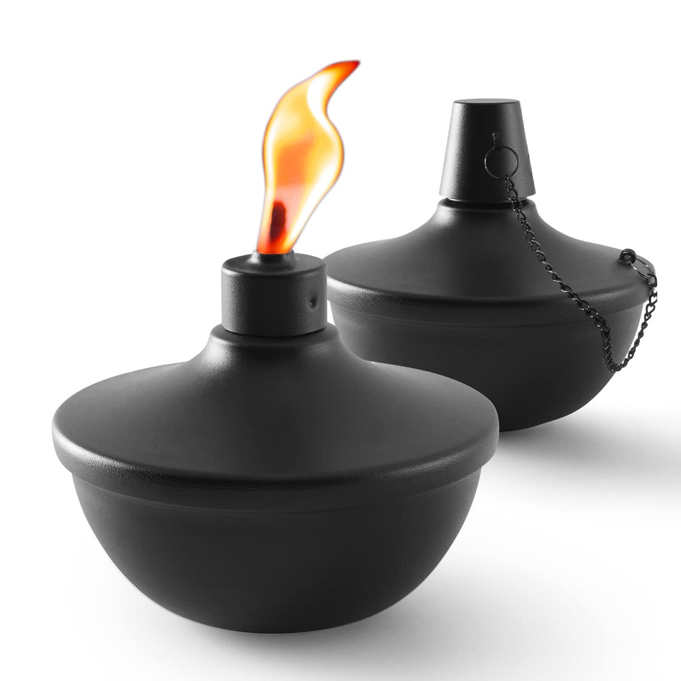 Snogswog 2-pack table torches sit on a table, adding warm outdoor ambiance.
