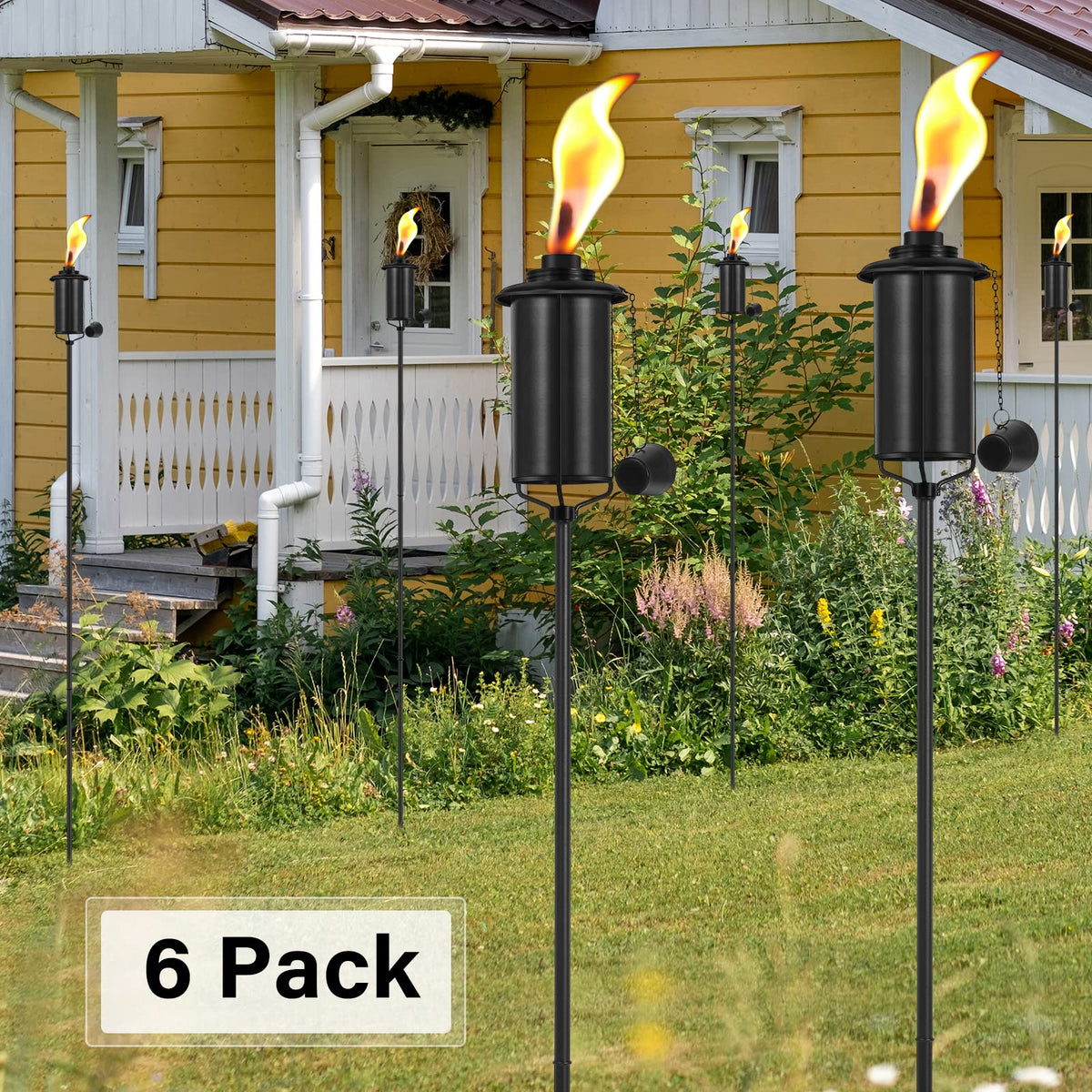 SNOGSWOG six-pack garden decor torches decorating a yard.
