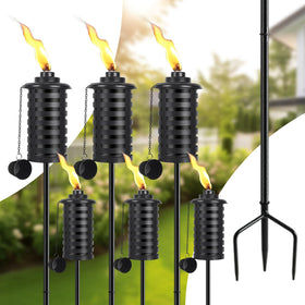 SNOGSWOG citronella torch with 3-prong stake for stable outdoor lighting.
