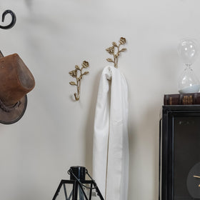 Close-up of the 3D bee detail on SOFFEE DESIGN hooks adds texture to entryway