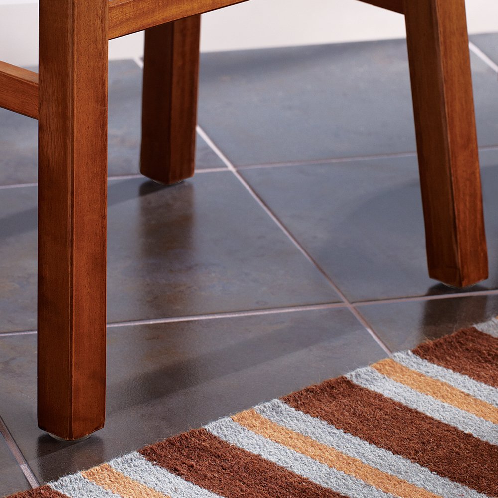 SOFTTOUCH 1-inch round nail-on felt pad in walnut brown finish blends with furniture legs.