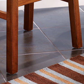 SOFTTOUCH 1-inch round nail-on felt pad in walnut brown finish blends with furniture legs.
