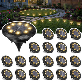 SOLPEX mini solar ground lights illuminate garden paths with warm glow.