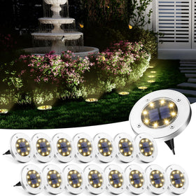 SOLPEX solar ground light disk warms garden paths for clear nighttime navigation