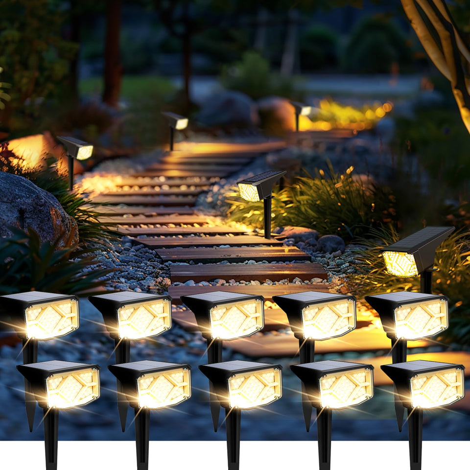 SOLPEX solar spot light illuminating a garden path with warm white glow