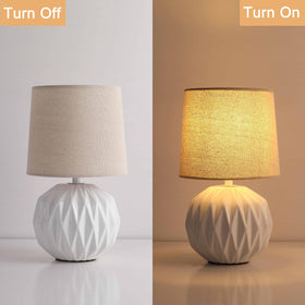 Somniferous bedside lamp lit creates warm ambient glow.