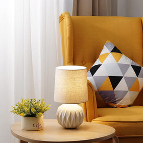 Somniferous lamp complements a living room corner setup.