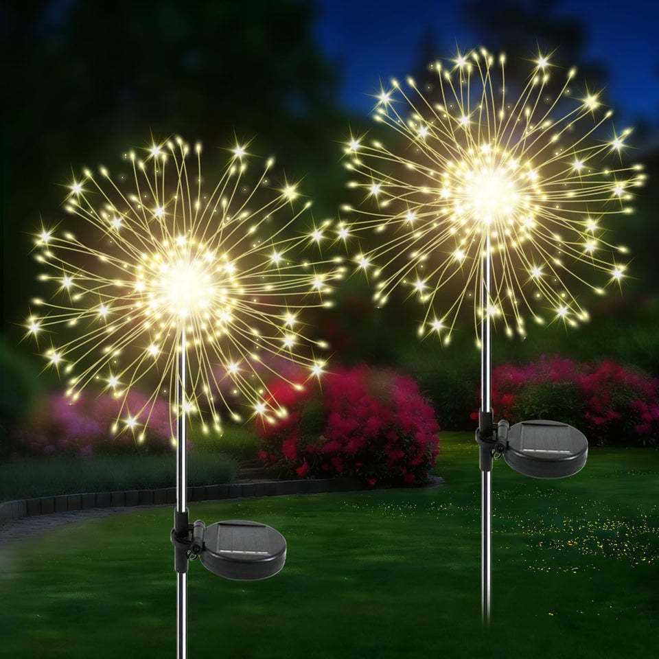 Soomit solar garden lights illuminate a garden at dusk with warm twinkling LEDs.