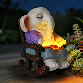 SOWSUN solar elephant reading statue glows warmly at night for cozy outdoor spaces