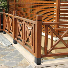 Spaceeup 4x4 base secures porch railing posts on a deck.