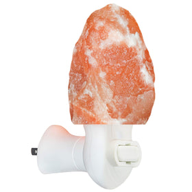 Spantik pink Himalayan salt lamp on a bedside table creates a calming night light.