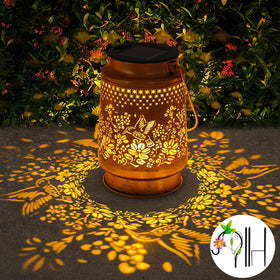 Stadeco solar lantern hanging on shepherd hook provides easy garden lighting.