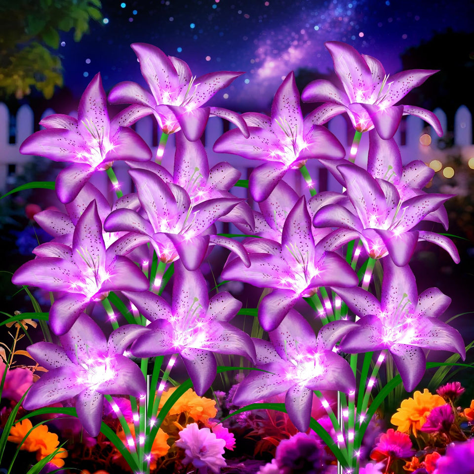 Stadeco solar lily lights four-pack with purple LEDs brighten garden nights for outdoor decor.