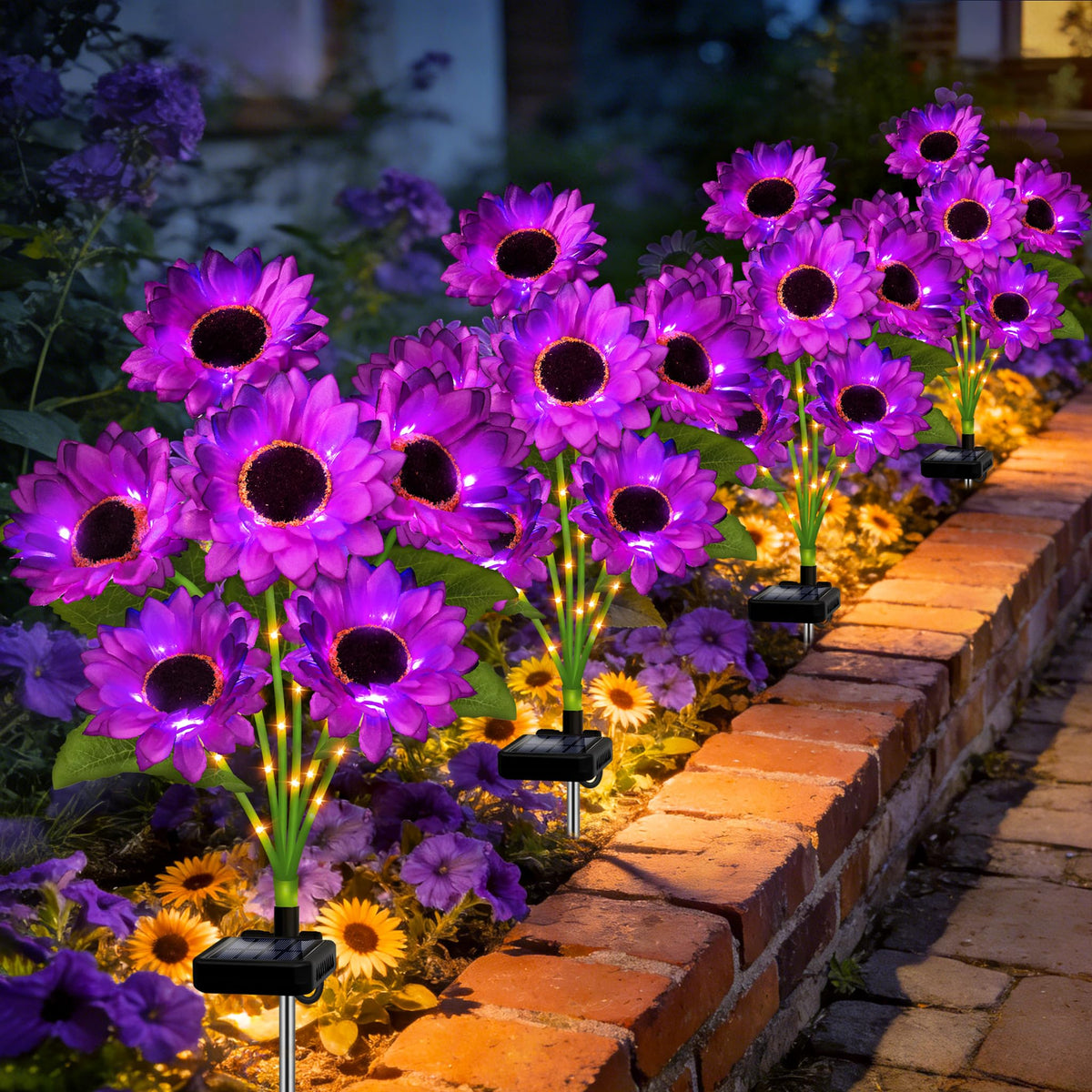 Stadeco Solar Sunflower Lights illuminate garden borders with vibrant blooms at dusk.