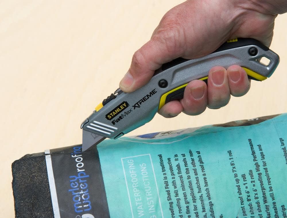 STANLEY Twin Blade Knife rubber grip minimizes fatigue.