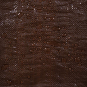 Stansport brown tarp with reinforced grommets ready for setup.