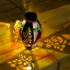 Starsoul Cardinal Lantern projects warm light along pathways.