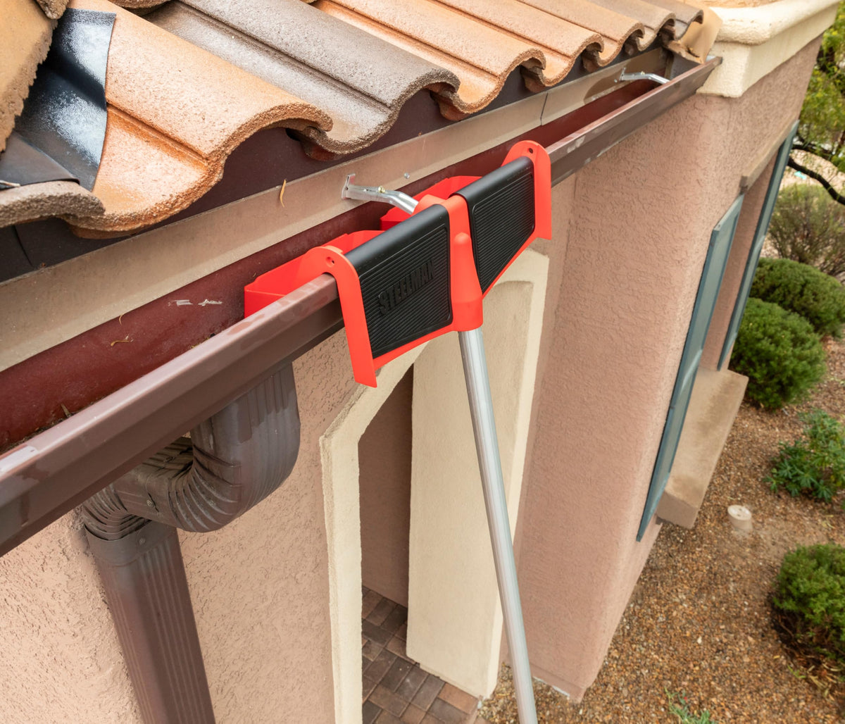 Steelman ladder stabilizer with dual storage trays visible for fasteners and parts
