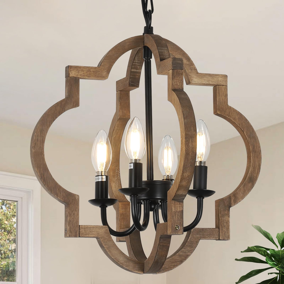 Stepeak farmhouse chandelier with wood frame adds warm rustic charm to dining room.