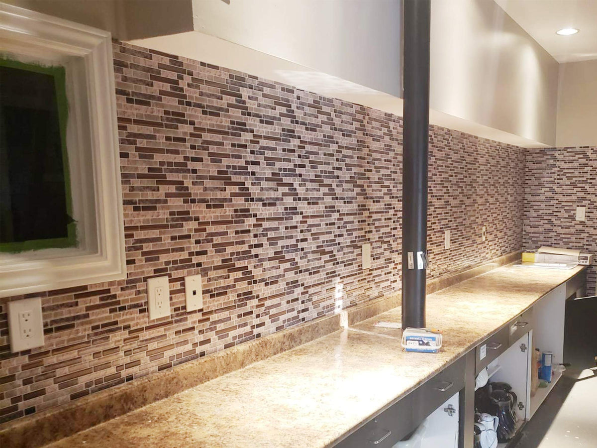 Stickgoo 12x12-inch panels installed for seamless coverage in a kitchen area.