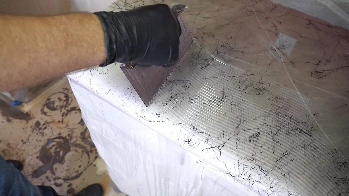 Stone Coat tools kit edge coverage on corners and trims with brushes.