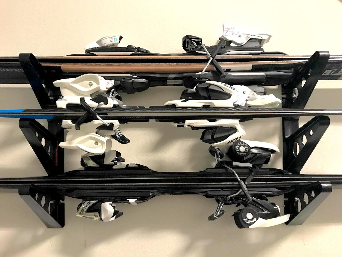 StoreYourBoard multi-gear compatibility allows storing skis, boards, and more on a wall
