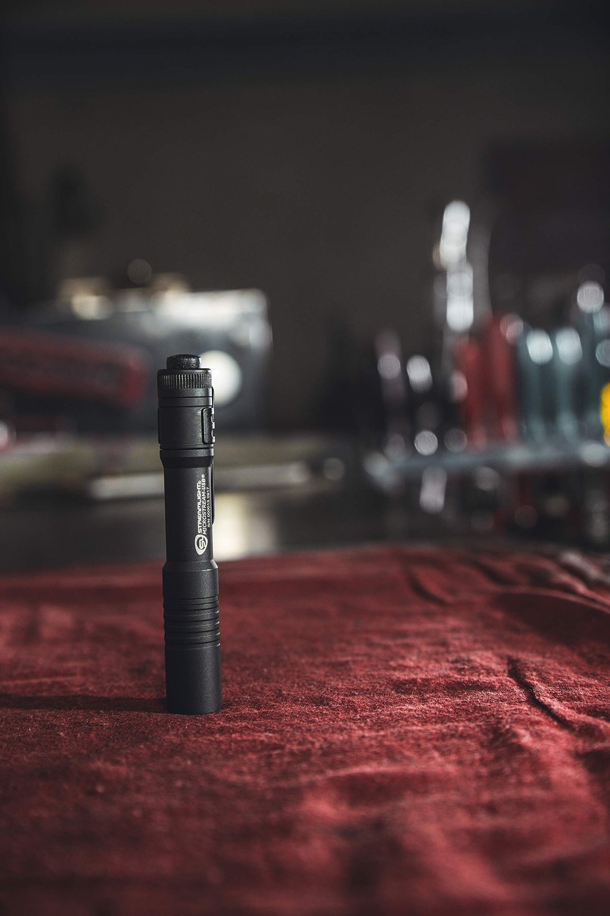 Streamlight MicroStream USB flashlight with USB charging cable visible for easy recharge.